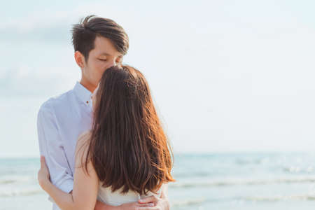 romantic time loving couple kissing on the beach. Love travel concept.の写真素材