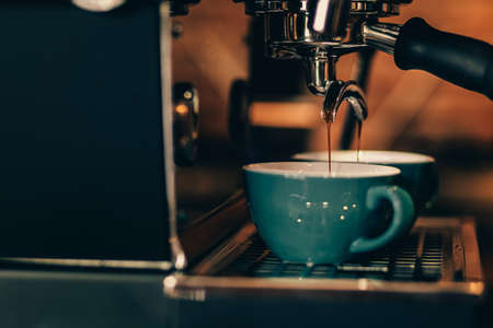 Barista cafe making coffee with coffee machine. Coffee preparation service concept.の写真素材