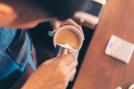 Barista making cappuccino, bartender prepare coffee drink at coffee shop .の写真素材