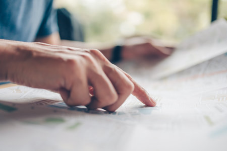 Tourist planning vacation pointing with the map. Vocation, travel, holidays and backpack concept.