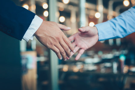 Business shaking hands, finishing up meeting. Successful businessmen handshaking after good deal.の写真素材