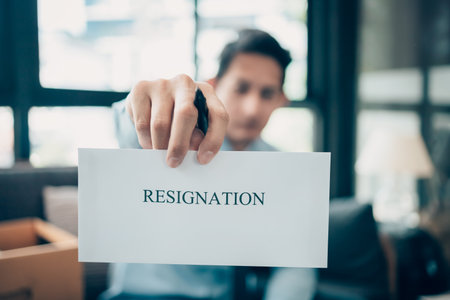 Businessman sending and showing resignation letter to employer boss. Quitting a job, businessman...