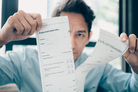 Businessman ripped out an Employment Application form because him not accept HR offer salary. job...