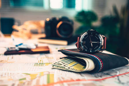 watch, money wallet, passport, airplane model, camera on road map. Object for travel concept.の写真素材