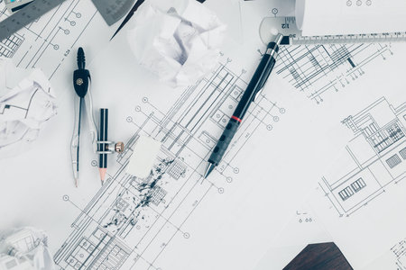 eraser crumbs, compass and pencil  on drawing design working on bueprint. House planning design and...