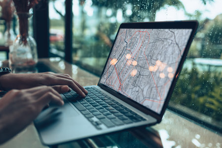 Travelers planning trips and use laptop to book hotels, buy plane tickets, search map, or find travel routes. Travel concept.の写真素材