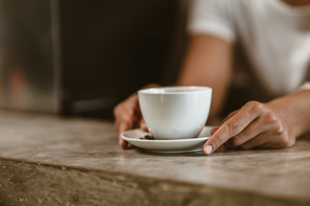 Barista serving a coffee to customer at the coffee shop.の写真素材