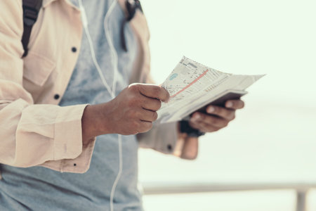 Tourists hold maps to find attractions, restaurants or hotels. backpacker and travel concept.