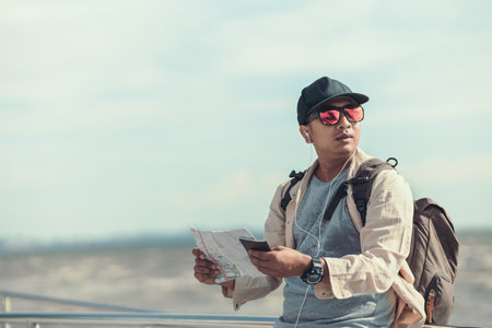 Tourists hold maps to find attractions, restaurants or hotels. backpacker and travel concept.の写真素材