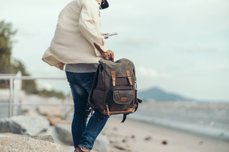 tourists are carrying bags. Backpacker and travel concept.の写真素材
