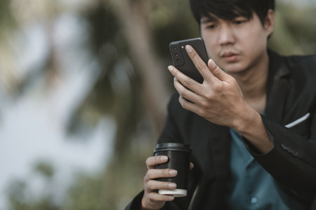 Employees fired or resigned from the company are using their mobile phones to search for jobs.
Unemployed, hiring job, quitting job concept.の写真素材