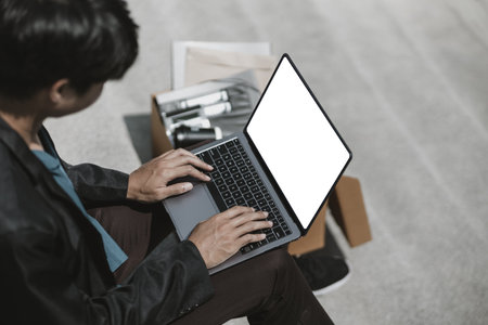 Employees fired or resigned from the company use laptop to find a job, schedule an interview.
Unemployed, hiring job, quitting job concept.の写真素材