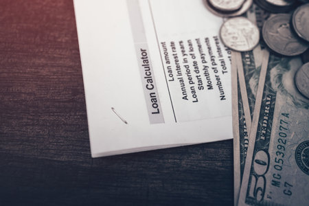 Stack of money coin and money bill  for saving money growing business on loan document, saving plan. Business and finance concept.の写真素材