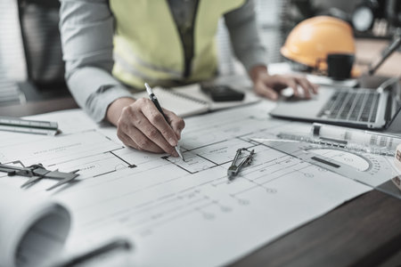 Engineering working with drawings inspection and writing on Blueprint. Engineer, Architect, Industry and factory concept.の写真素材