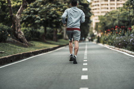 A man  jogging in the city center park cardio workout, running.  Health and Lifestyle in big city...