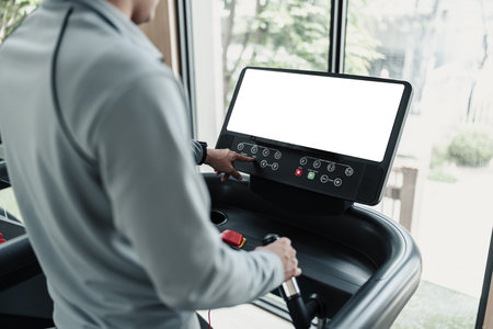 finger press botton running treadmill at gym for cardio. Fitness workout concept.の写真素材