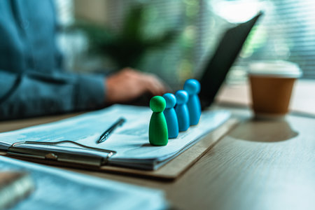 The wooden doll represents the employee of the company and Human Resource use magnifying glass view them on document in workplace. Search or find new job and Corporation, Enterprisの写真素材