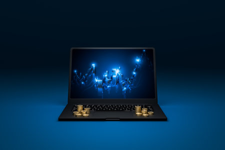 stock charts on laptop screens represent finance and coin stack represent finance.の写真素材