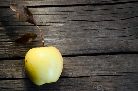 Apple on a wooden surface の写真素材