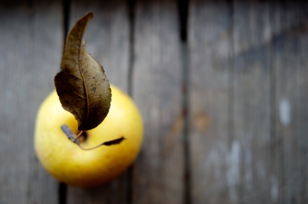 Apple on a wooden surface の写真素材