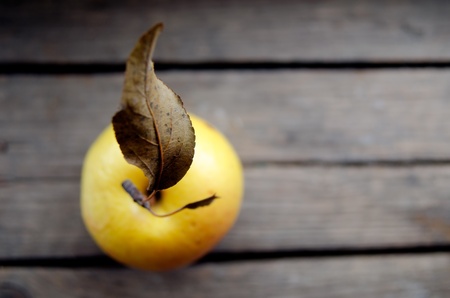 Apple on a wooden surface の写真素材