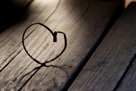 Heart shape on a old wood planksの写真素材