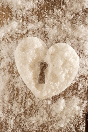 snow heart with a keyholeの写真素材