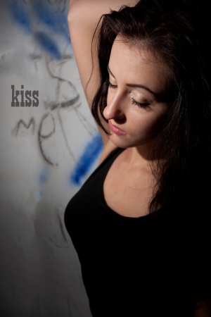 Beautiful girl and writing on the wall の写真素材