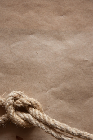 Aged Rope on the old paper background.の写真素材