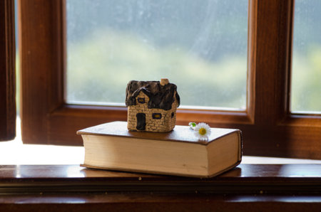 Ð¡oncept house. Toy house on the windowの写真素材