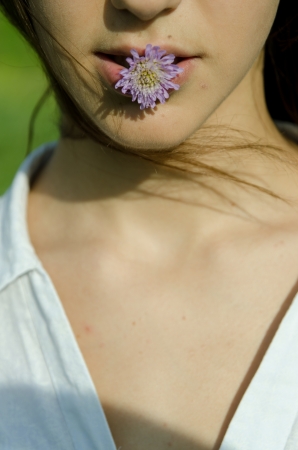 Girl with blue flower- Cornflower.の写真素材
