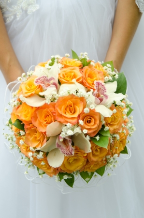 Beautiful wedding bouquet in hands of the brideの写真素材