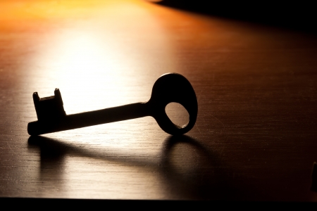 Key on a wooden background.の写真素材