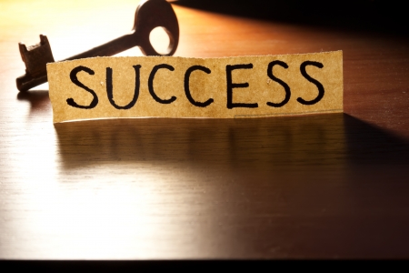 The Key to Success. Key on a wooden background.の写真素材