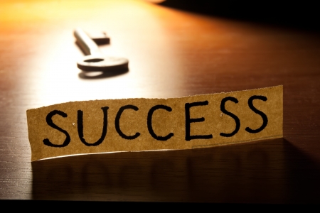 The Key to Success. Key on a wooden background.の写真素材