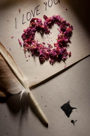 Valentine. 'I love you', heart on the old paper and feather pen.の写真素材