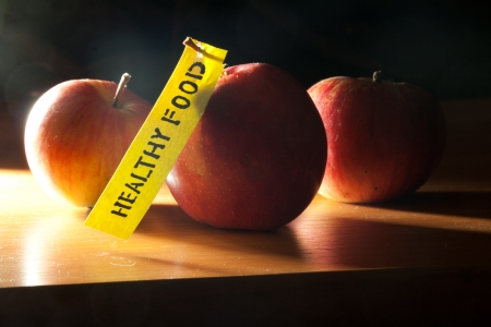 Inscription healthy food. Apples on the background.の写真素材
