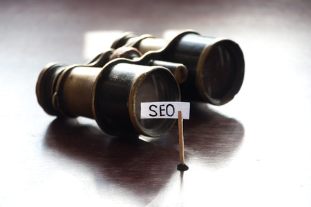 Search Engine Optimization, SEO concept, old binoculars and an inscription SEOの写真素材