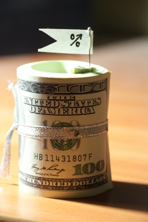 Percent growth concept. Sign and roll of banknotes.の写真素材