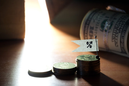 Percent growth concept. Sign, coins  and roll of banknotes.