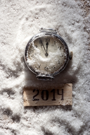 Watch lying in the snow before the new year and tag 2014の写真素材