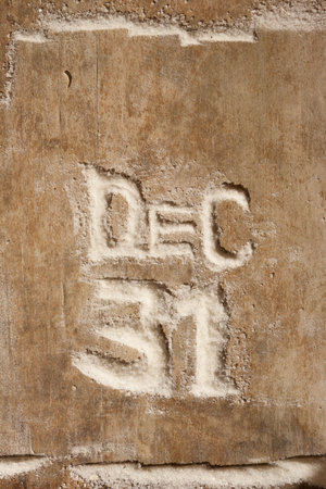 December 31, wood background, letters of snow 