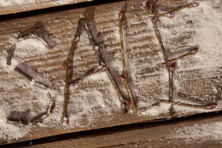 sale, inscription on the snow, wooden backgroundの写真素材