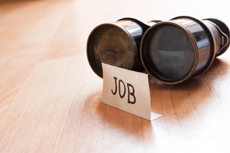 Looking for a job concept, sign job and vintage binoculars.の写真素材