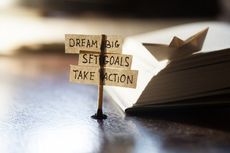 Dream Big, Set Goals, Take Action, concept, tags on the table.の写真素材