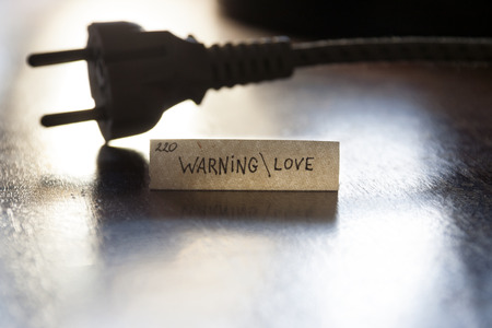 Warning  Love with plug connection, hand letteringの写真素材