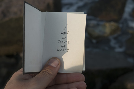 i want to travel the world - inscription on the book, travel backgroundの写真素材
