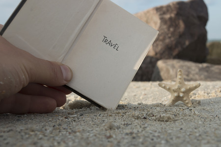 Travel - Inscription on the Book. Travel Concept. Beach background.の写真素材