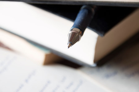 Book, pen and writing notes. Lesson, lecture, training, education concept