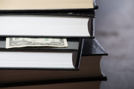 pile of books and moneyの写真素材